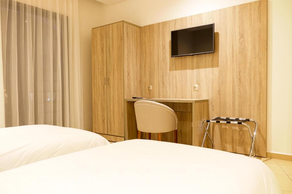 Postel nebo postele na pokoji v ubytování Hotel El Djenina