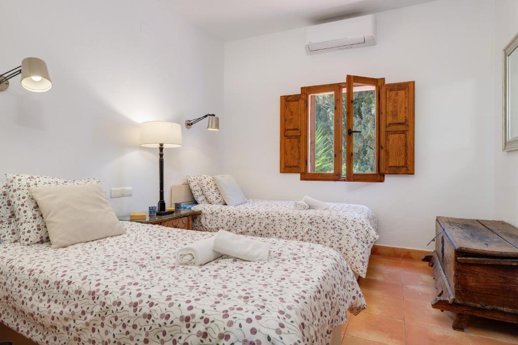 Postel nebo postele na pokoji v ubytování Casa Arevale