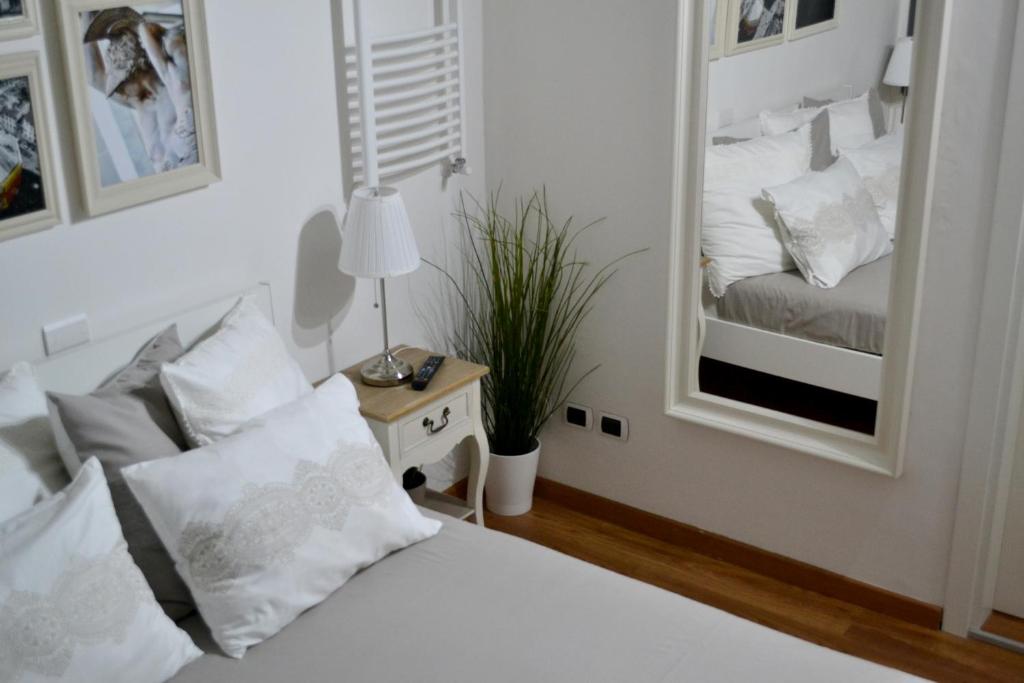Rúm í herbergi á Pontevecchio Relais