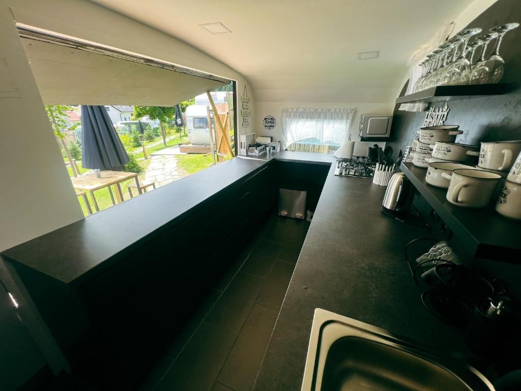 Kuchyň nebo kuchyňský kout v ubytování Glamping Langus