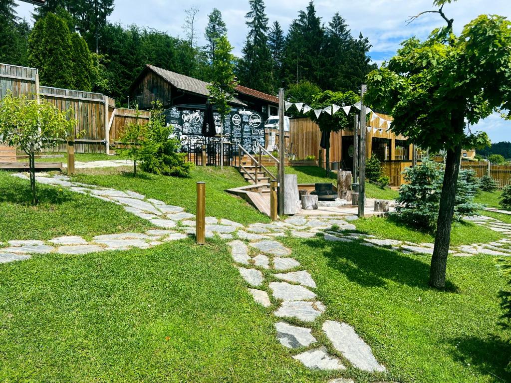 a stone path in front of a house at Glamping Langus in Topolšica