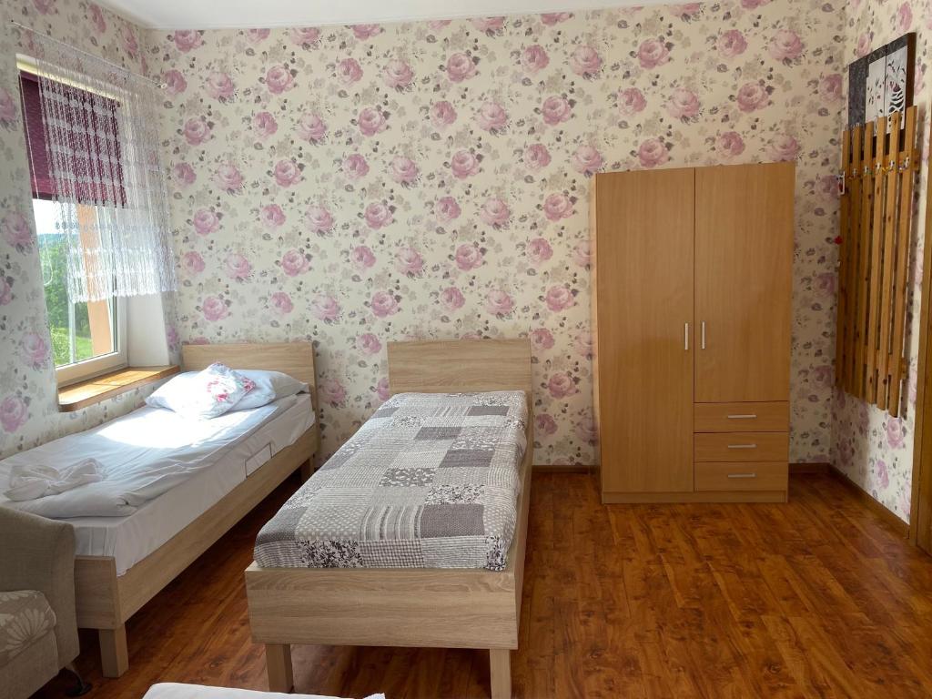 Posteľ alebo postele v izbe v ubytovaní Babie Lato