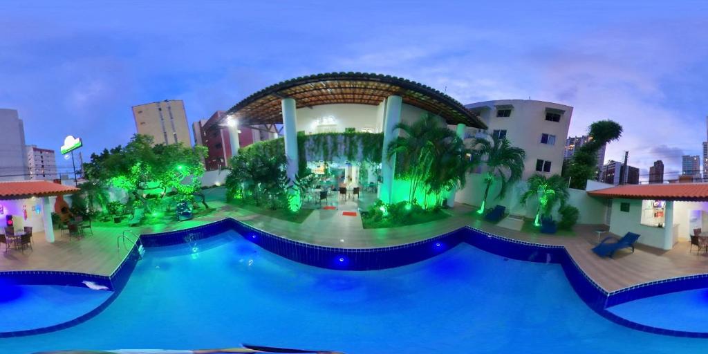 a view of a resort with a swimming pool at LIVE IN FORTALEZA HOTEL in Fortaleza