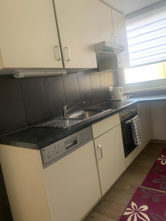 Kuchyňa alebo kuchynka v ubytovaní Smart Stay Apartment Feldkirch