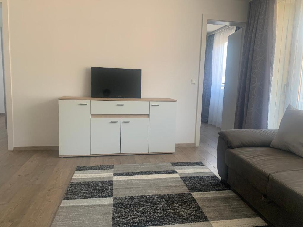 Televízia a/alebo spoločenská miestnosť v ubytovaní Smart Stay Apartment Feldkirch