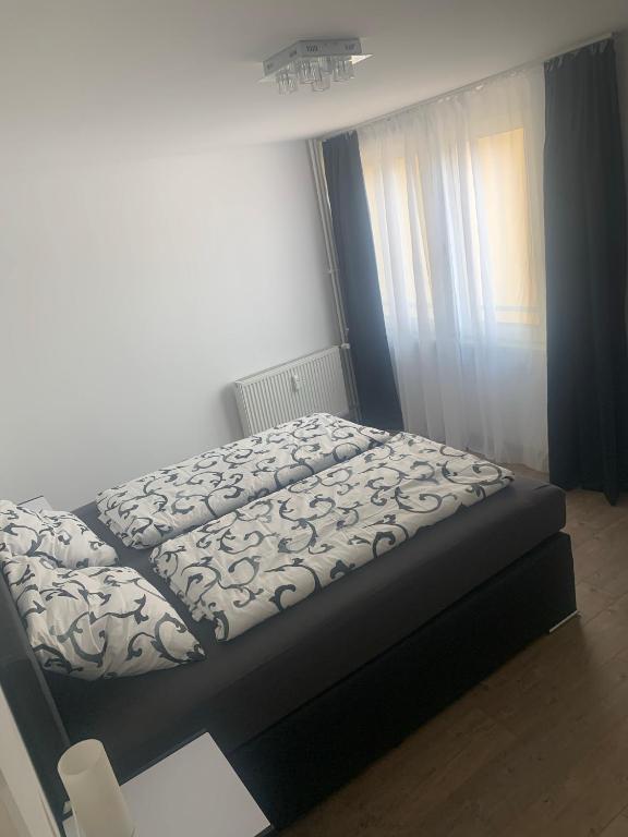 Posteľ alebo postele v izbe v ubytovaní Smart Stay Apartment Feldkirch