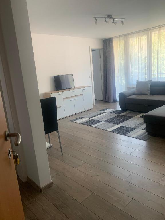 Televízia a/alebo spoločenská miestnosť v ubytovaní Smart Stay Apartment Feldkirch