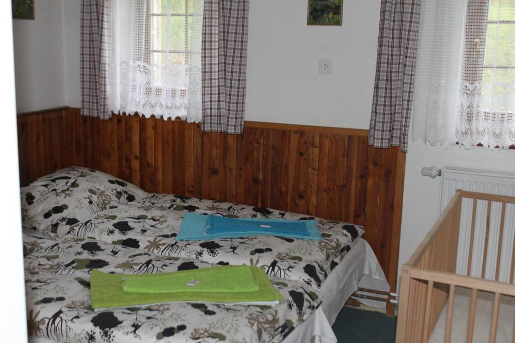 Postel nebo postele na pokoji v ubytování Apartmány Vydrýsek