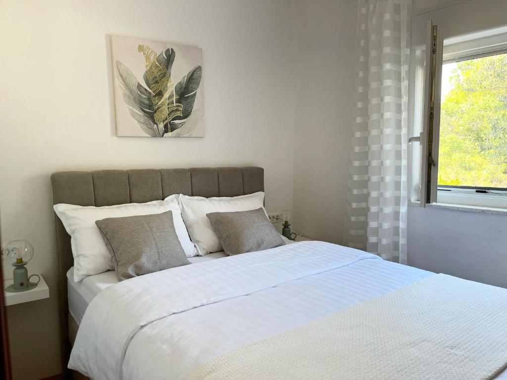 Łóżko lub łóżka w pokoju w obiekcie Apartments Fortuna