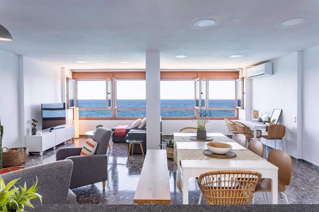 a living room with a view of the ocean at Apartamento El Palmer in Almería