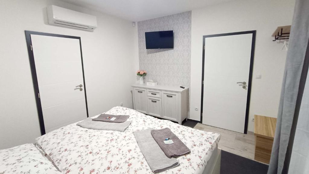 Postel nebo postele na pokoji v ubytování Penzion HARMONIE