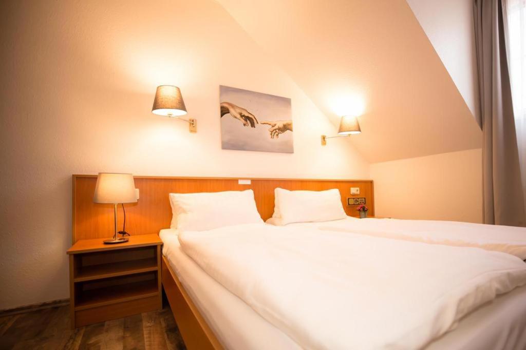 Voodi või voodid majutusasutuse Hotel Weiße Mühle toas