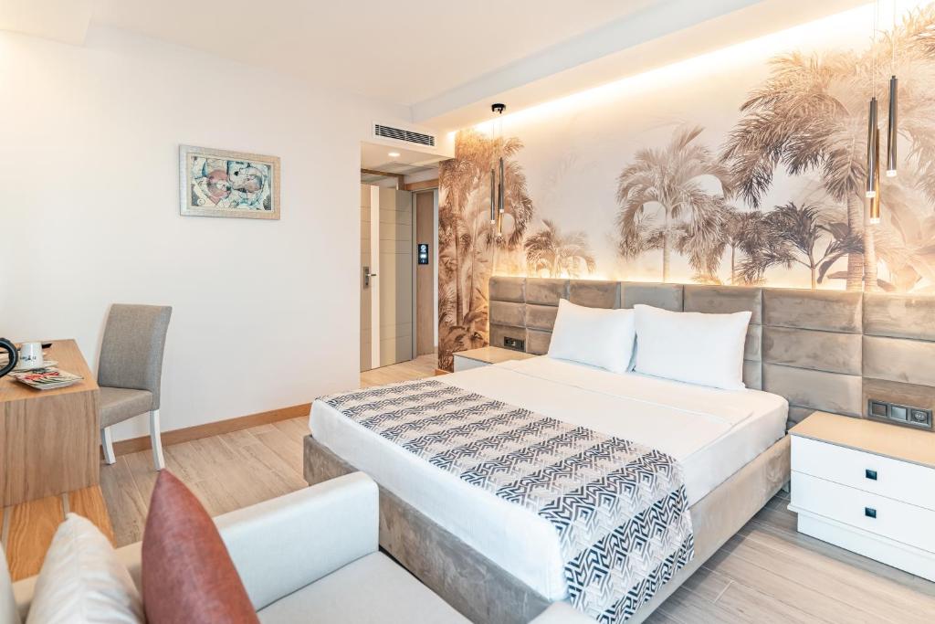 Postel nebo postele na pokoji v ubytování PEARLY HOTEL