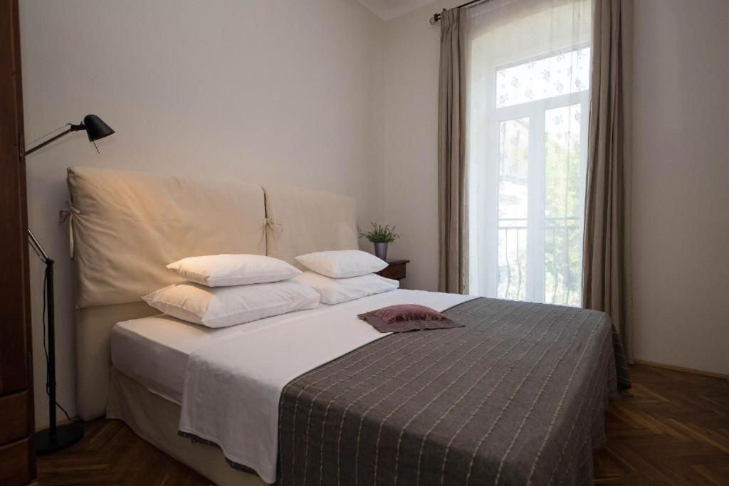 Posteľ alebo postele v izbe v ubytovaní Apartmani Marion Crikvenica