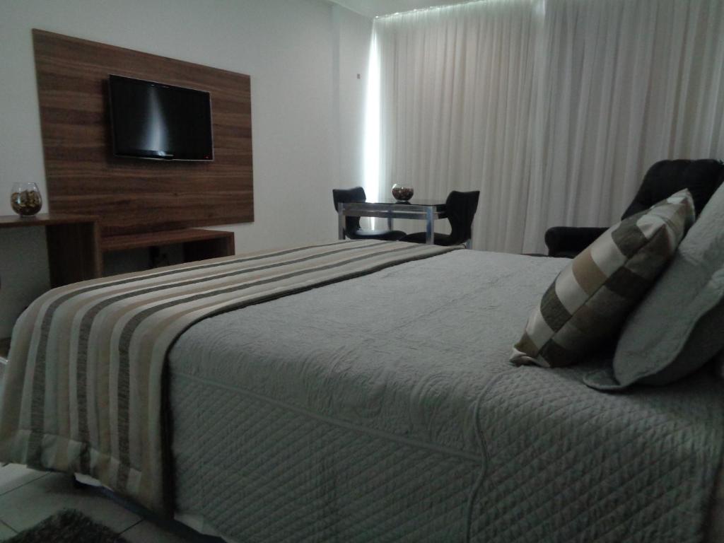 Postel nebo postele na pokoji v ubytování Cambuci Hotel