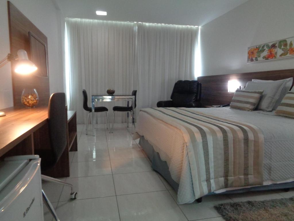 Postel nebo postele na pokoji v ubytování Cambuci Hotel
