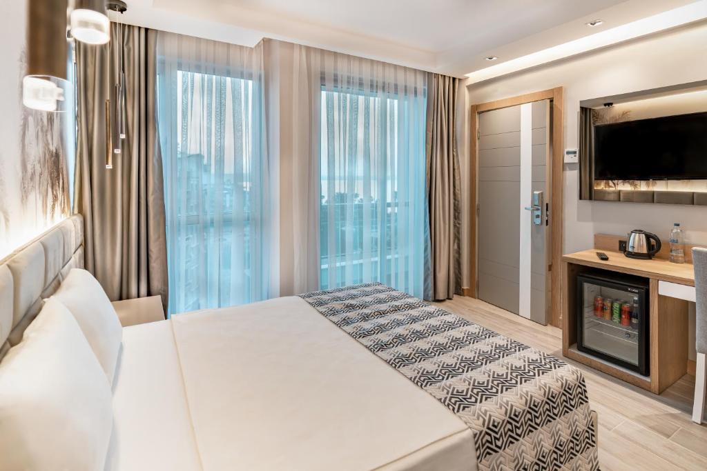 Postel nebo postele na pokoji v ubytování PEARLY HOTEL