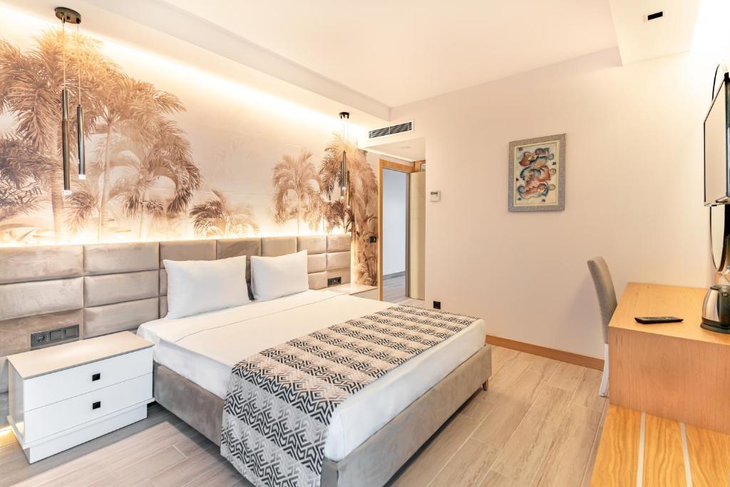 Postel nebo postele na pokoji v ubytování PEARLY HOTEL