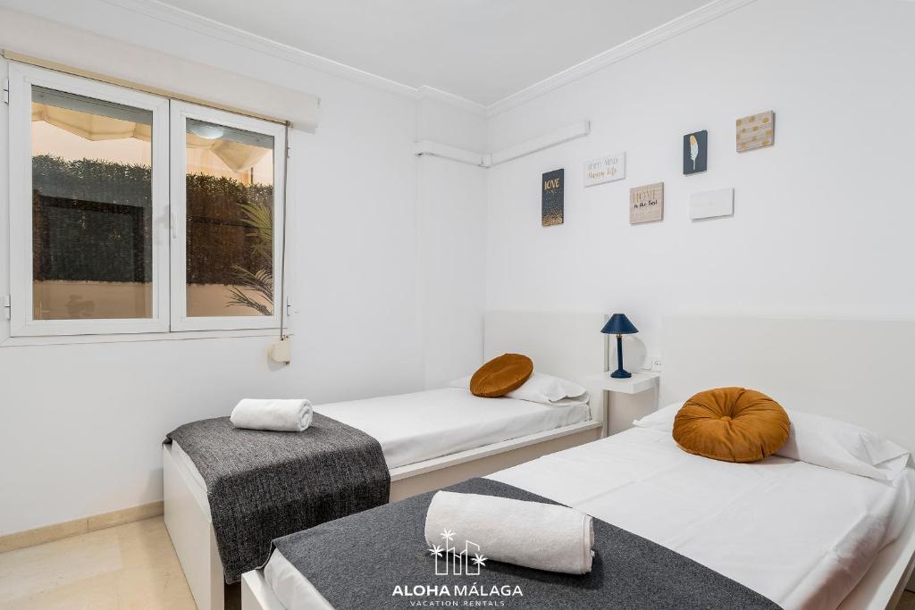 A bed or beds in a room at Wonderful Malaga Centro Apartment