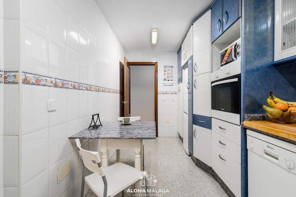 A kitchen or kitchenette at Wonderful Malaga Centro Apartment