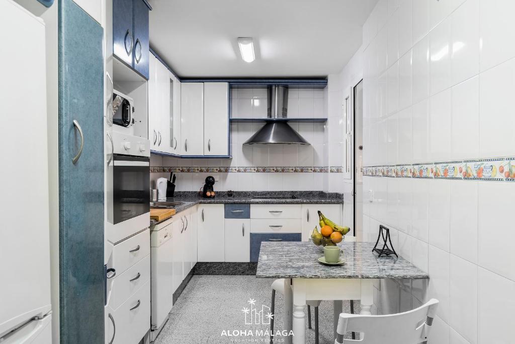 A kitchen or kitchenette at Wonderful Malaga Centro Apartment