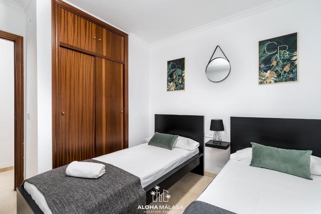 A bed or beds in a room at Wonderful Malaga Centro Apartment