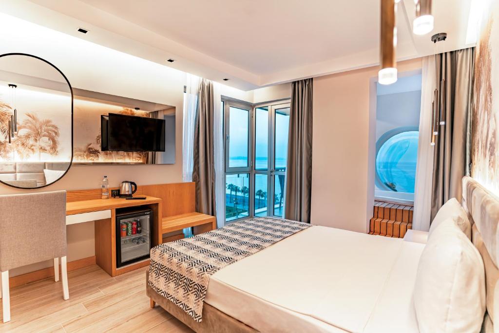 Postel nebo postele na pokoji v ubytování PEARLY HOTEL