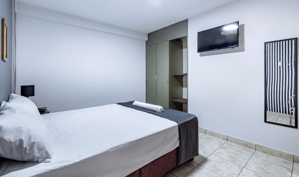 Postel nebo postele na pokoji v ubytování Hotel Taurus