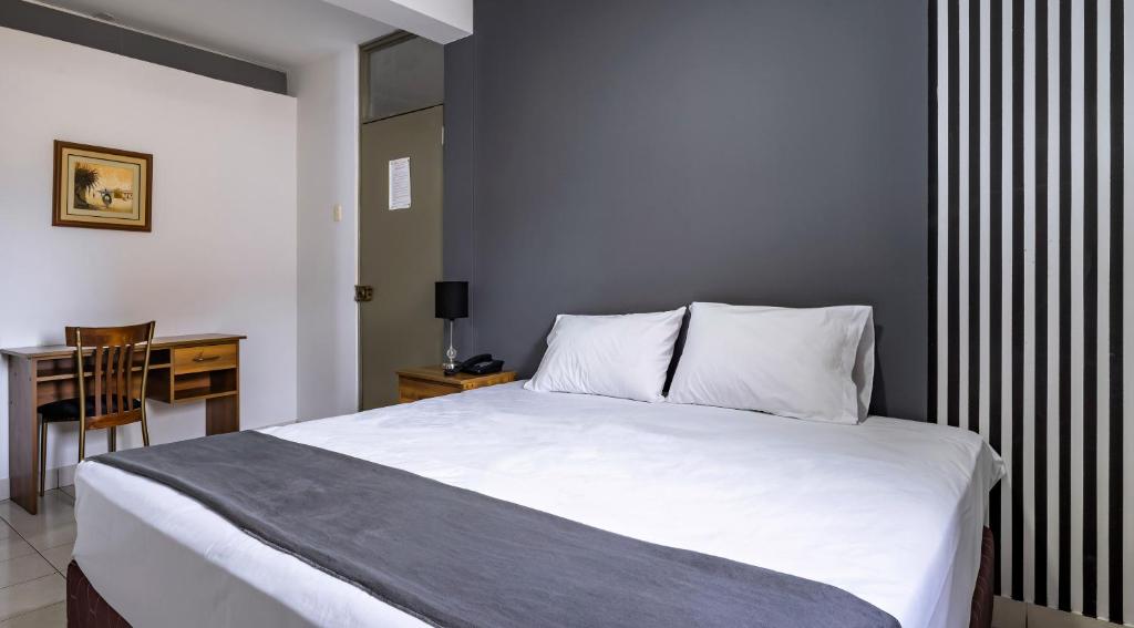 Postel nebo postele na pokoji v ubytování Hotel Taurus
