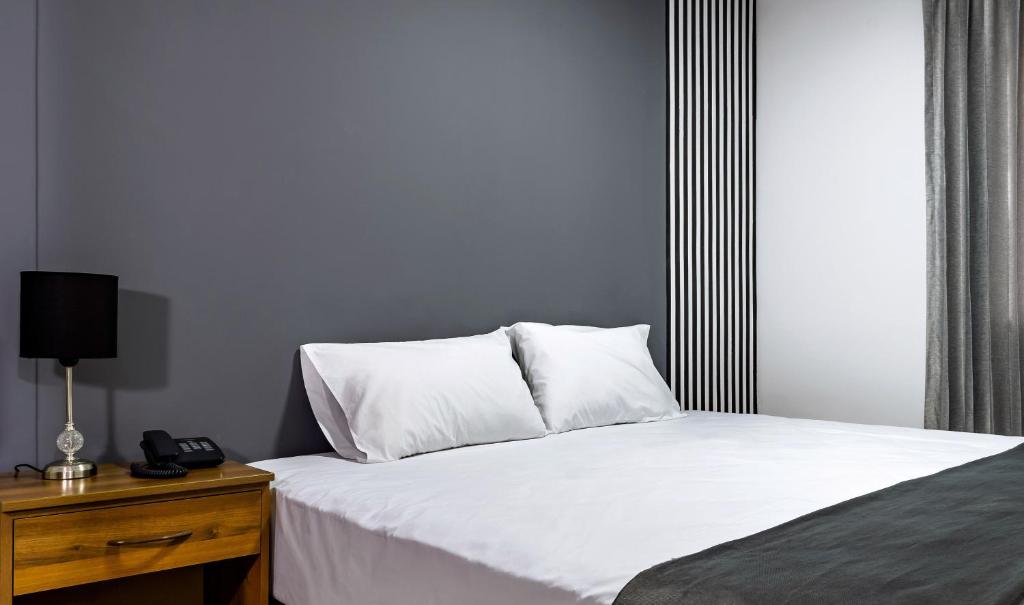 Postel nebo postele na pokoji v ubytování Hotel Taurus