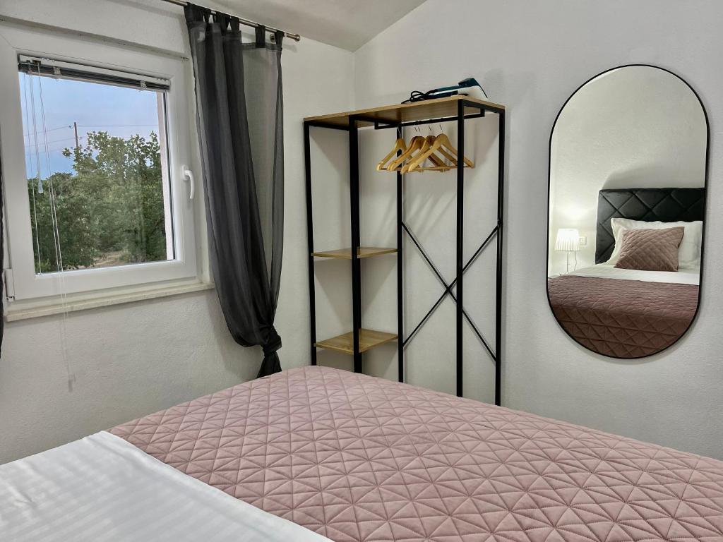 Łóżko lub łóżka w pokoju w obiekcie Apartments Fortuna