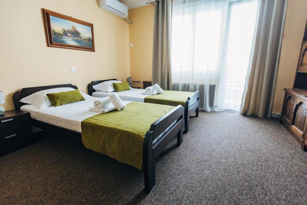 Postel nebo postele na pokoji v ubytování Laguna Green Guest House