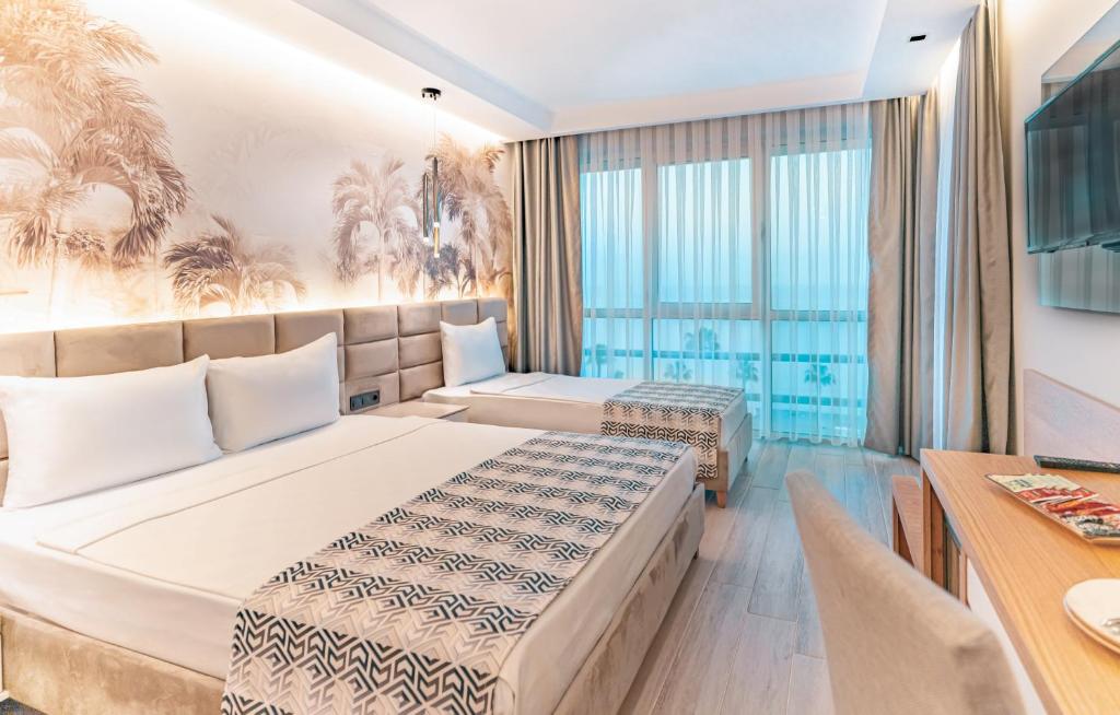 Postel nebo postele na pokoji v ubytování PEARLY HOTEL