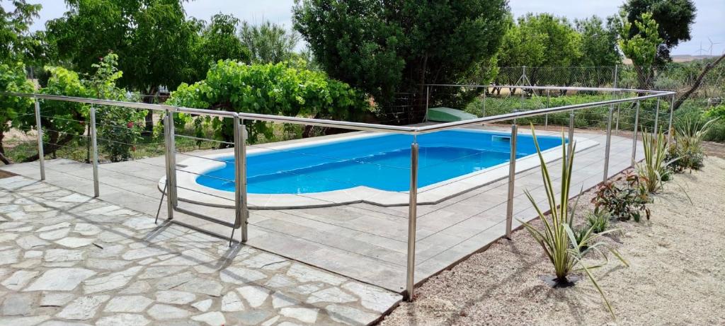 a swimming pool with a metal fence around it at Casa Tere in Codo