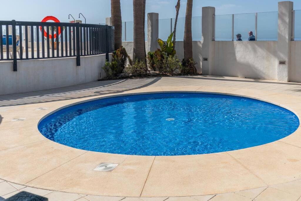 Bazén v ubytování Beachfront sea view in cozy 1BR with pool and garage nebo v jeho okolí