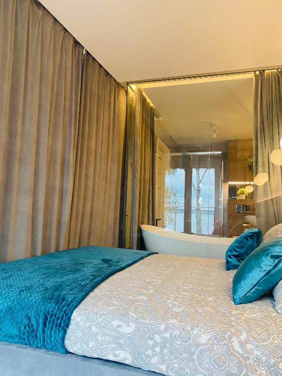 Posteľ alebo postele v izbe v ubytovaní Apartament MoLoo III
