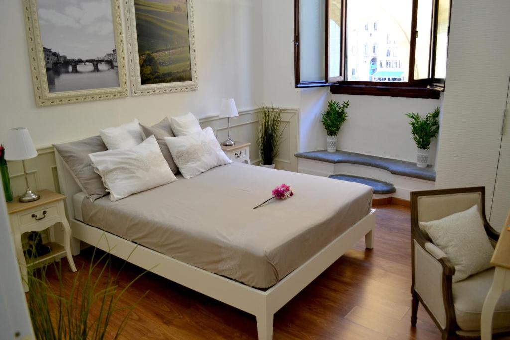 Rúm í herbergi á Pontevecchio Relais