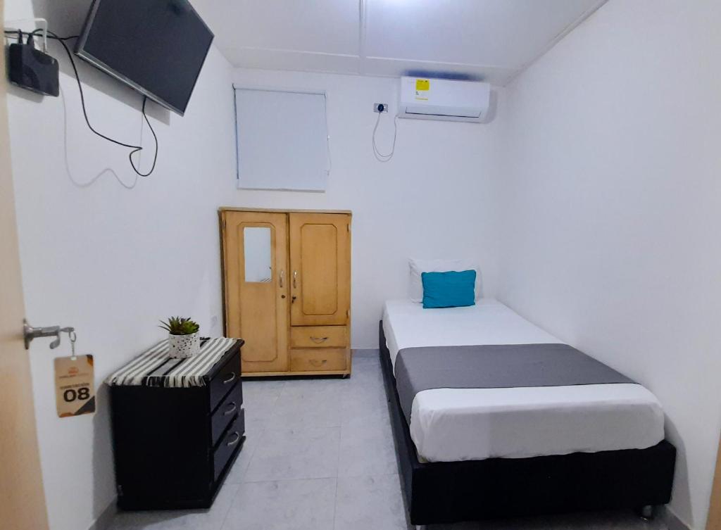 Postel nebo postele na pokoji v ubytování Hotel Poblado Suite