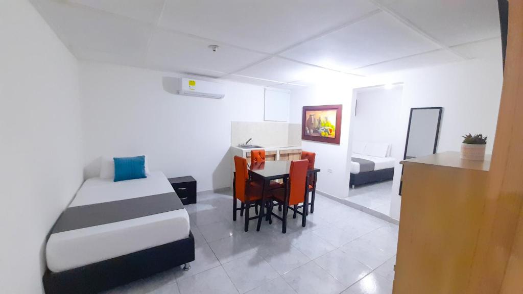 Postel nebo postele na pokoji v ubytování Hotel Poblado Suite