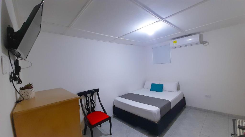 Postel nebo postele na pokoji v ubytování Hotel Poblado Suite