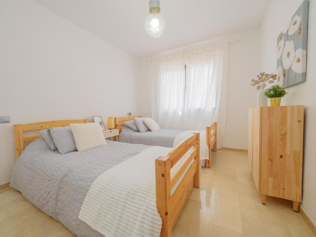 Postel nebo postele na pokoji v ubytování Cubo's Apartamento Las Acacias Beach