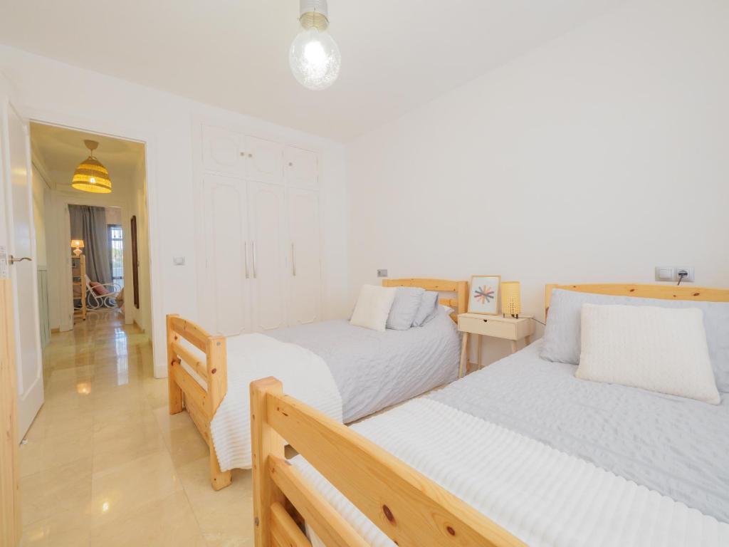 Postel nebo postele na pokoji v ubytování Cubo's Apartamento Las Acacias Beach