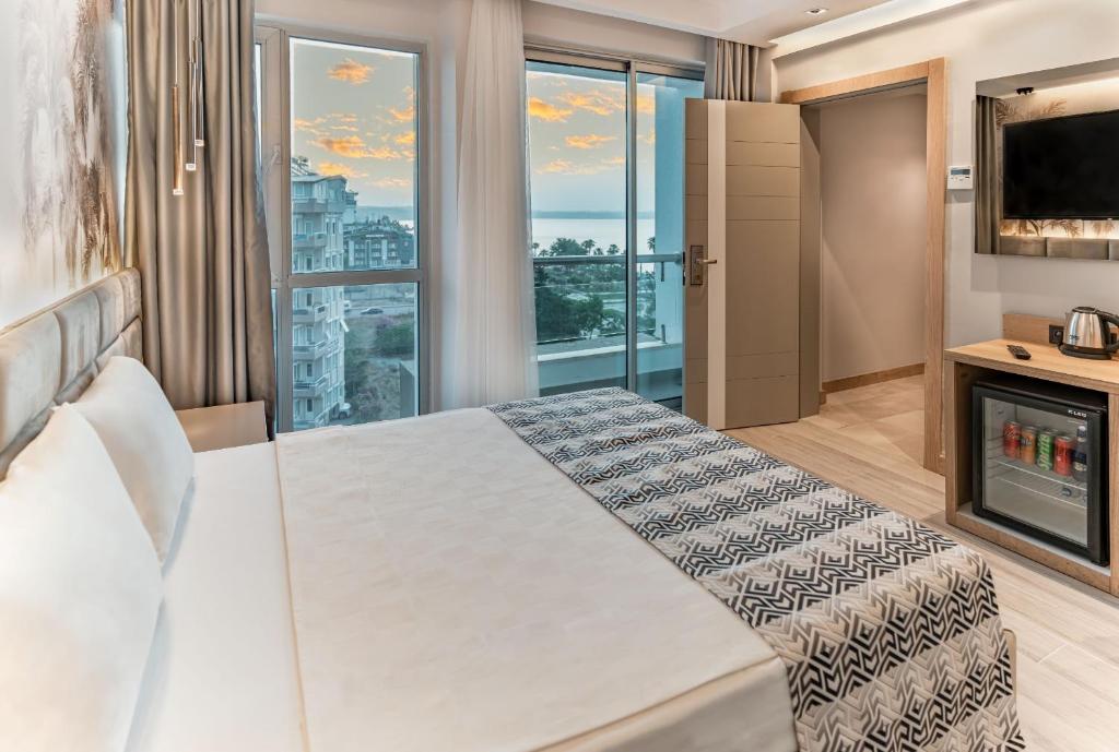 Postel nebo postele na pokoji v ubytování PEARLY HOTEL