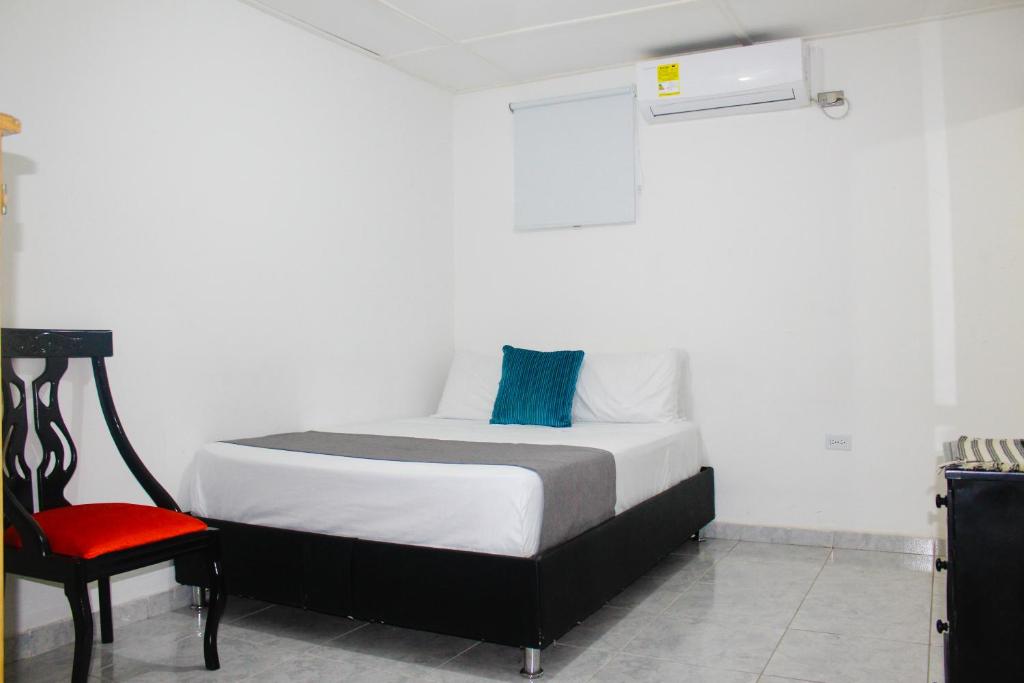 Postel nebo postele na pokoji v ubytování Hotel Poblado Suite