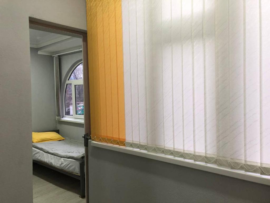 Postel nebo postele na pokoji v ubytování Downtown Homestay