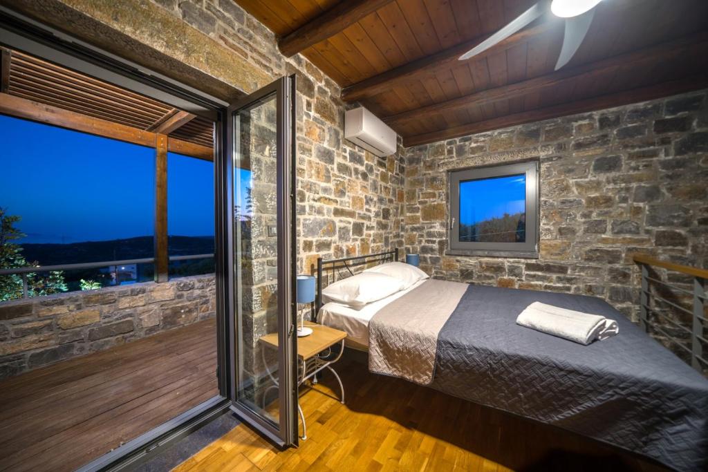 Postel nebo postele na pokoji v ubytování Terra Zeus Skalani