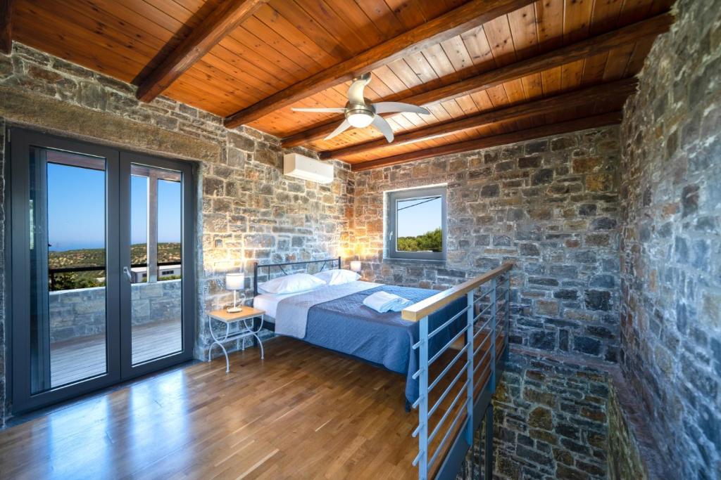 Postel nebo postele na pokoji v ubytování Terra Zeus Skalani