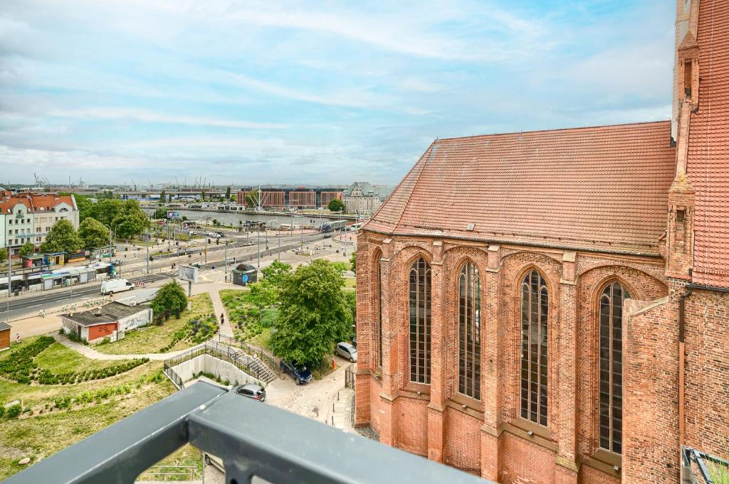 a view of a brick building with a street at Apartament 2000 Stare Miasto bulwary Apartamenty No 1 in Szczecin