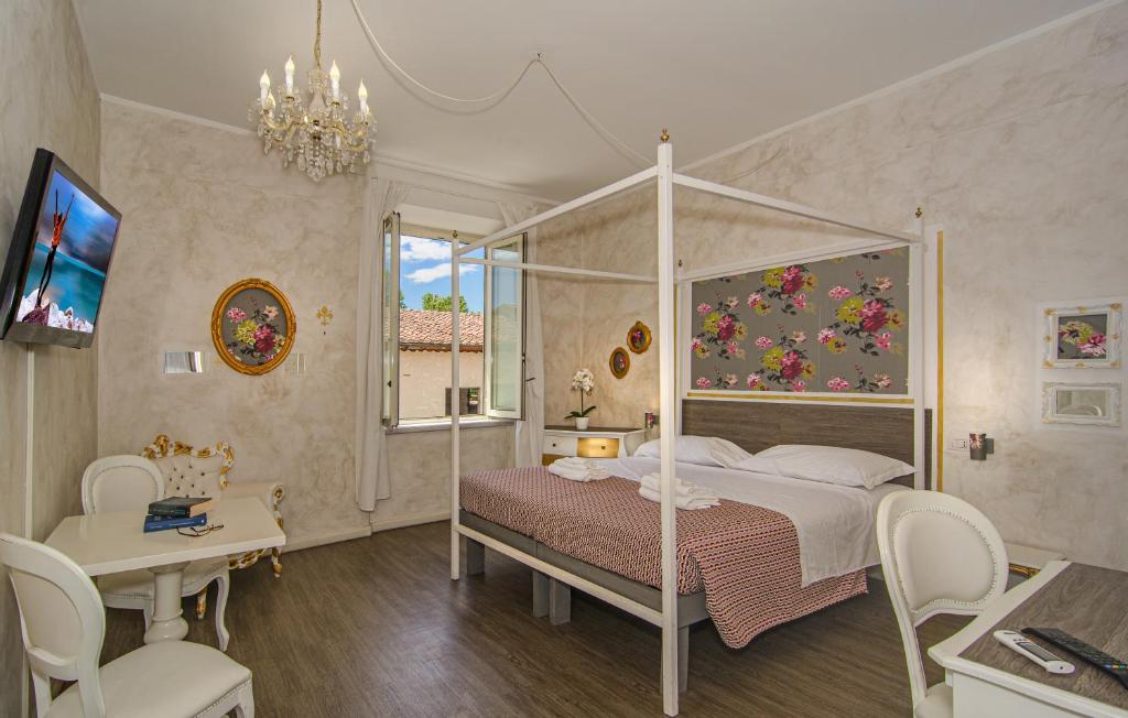 Postel nebo postele na pokoji v ubytování B&B Relais Inn Lucca