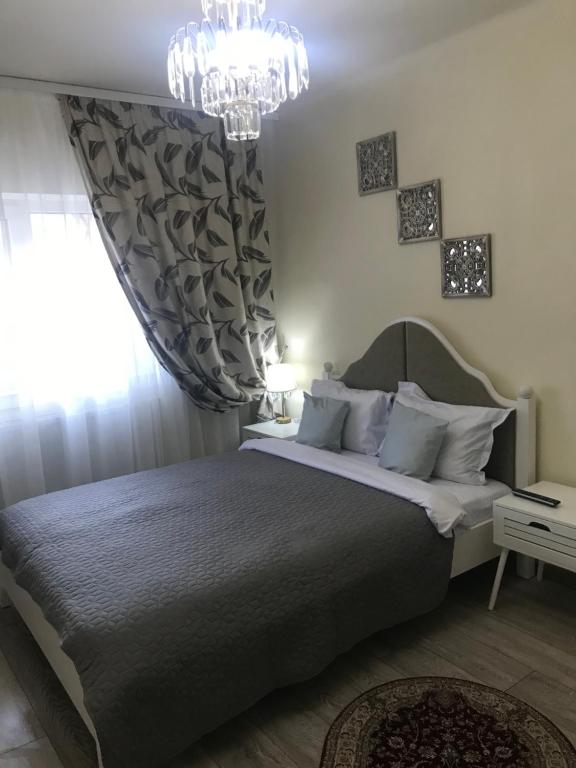 Postel nebo postele na pokoji v ubytování RELAX Downtown Suite